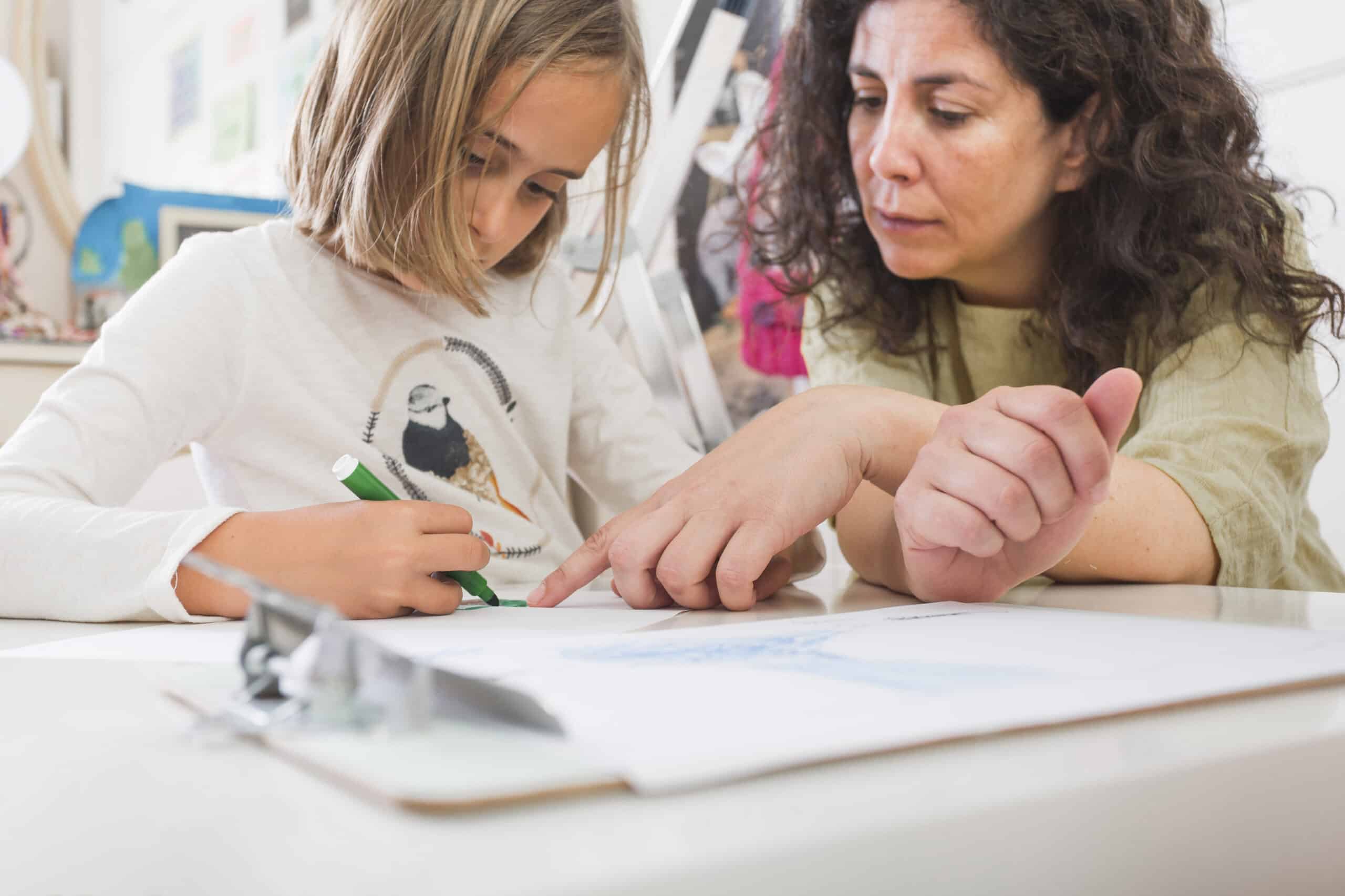 mother-helping-girl-with-drawing mother-helping-girl-with-drawing